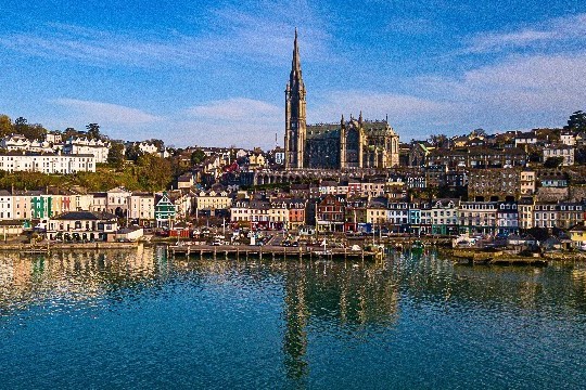 Port scene with dock, colourful houses and cathedral