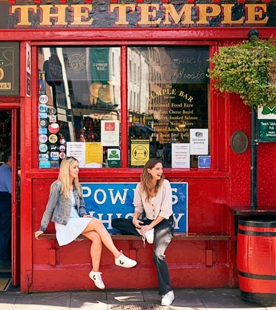 Two women sitting outside a Dublin pub