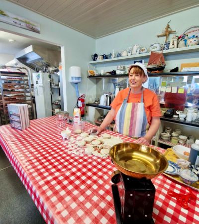 Woman baking scones in kitchen 